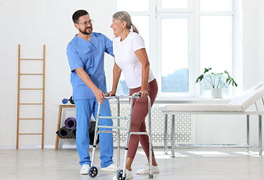 Therapist assisting an older adult